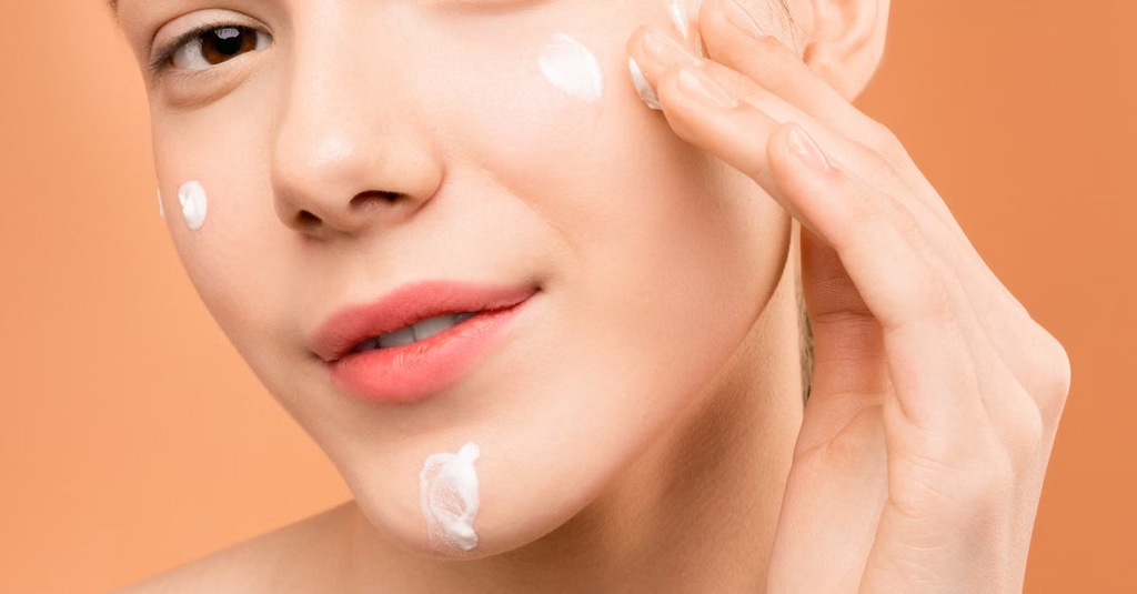 Woman applying sunscreen to her face to avoid common skincare mistakes